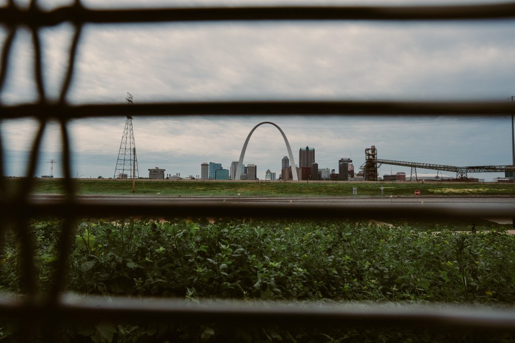 St. Louis Arch framed through a railing for a unique perspective.